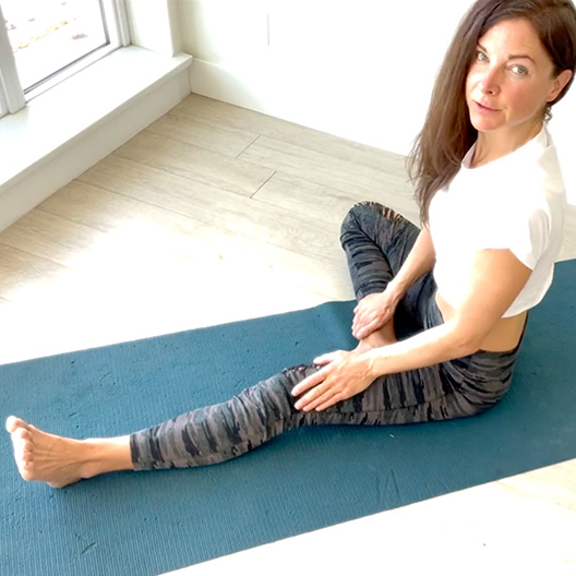 girl sitting on the floor with one leg out