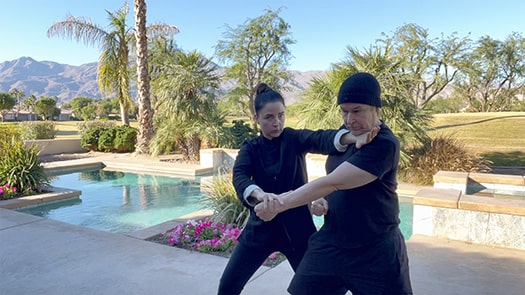 Sifu Kendra Mahon teaching a beginner Wing Chun student the Siu Nim Tao form