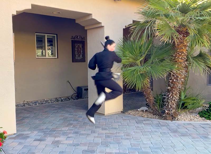 Sifu Kendra Mahon - Wing Chun Butterfly Swords Dynamic Technique Sifu Kendra performing spinning jump with butterfly swords