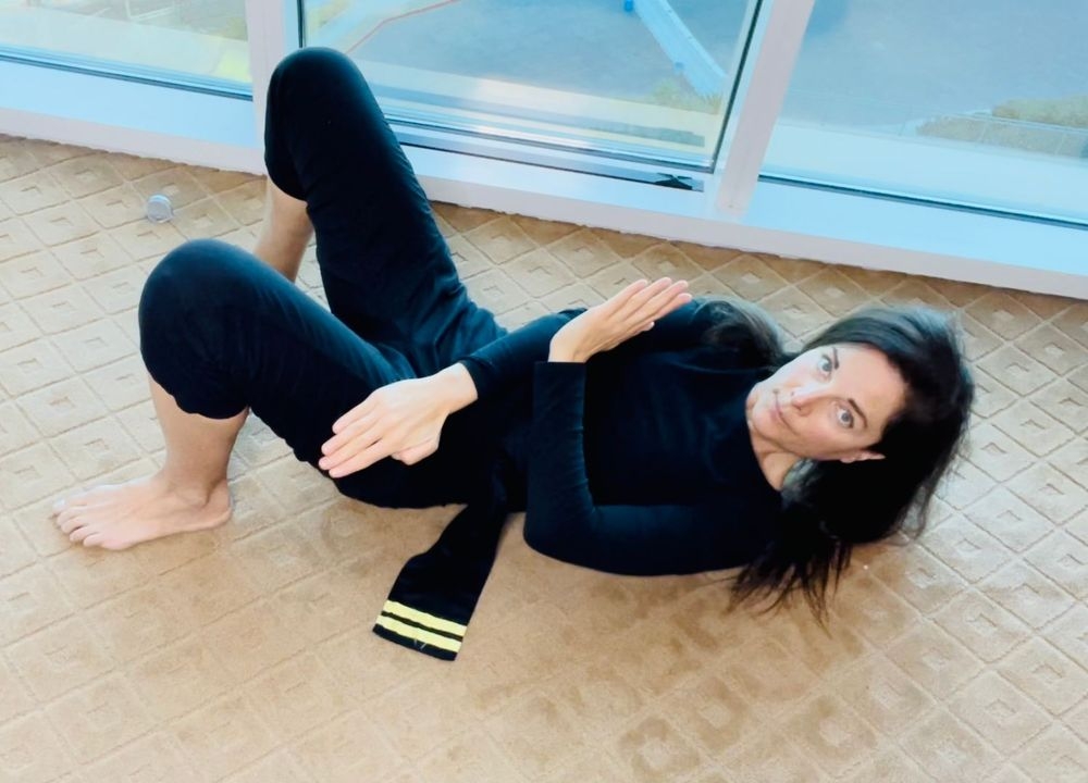 Female doing abdominal crunches on the floor
