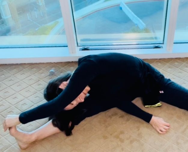 Female stretching on the floor