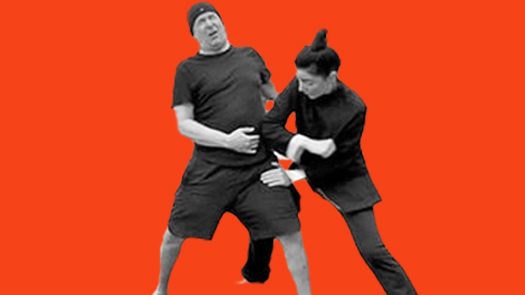 Sifu Kendra Mahon Kung Fu expert demonstrates elbow strike to the ribs with a partner