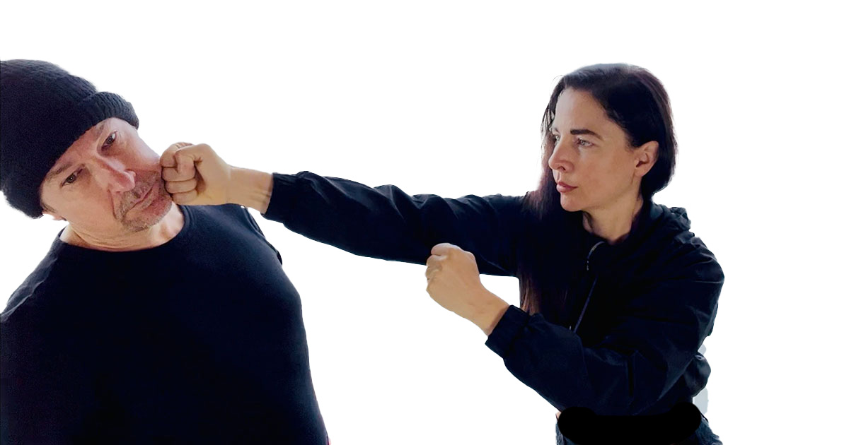 Sifu Kendra Mahon demonstrating Wing Chun techniques with a student