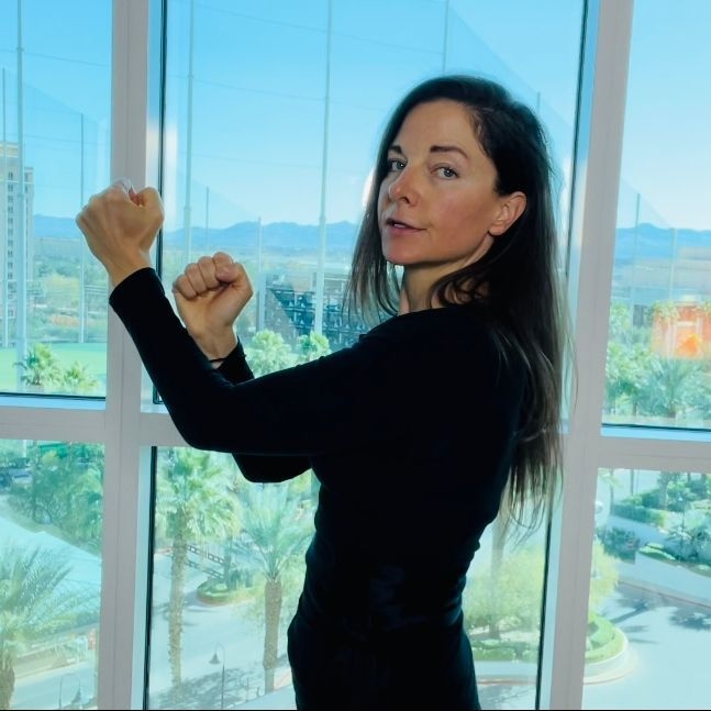 Expert female martial artist punching
