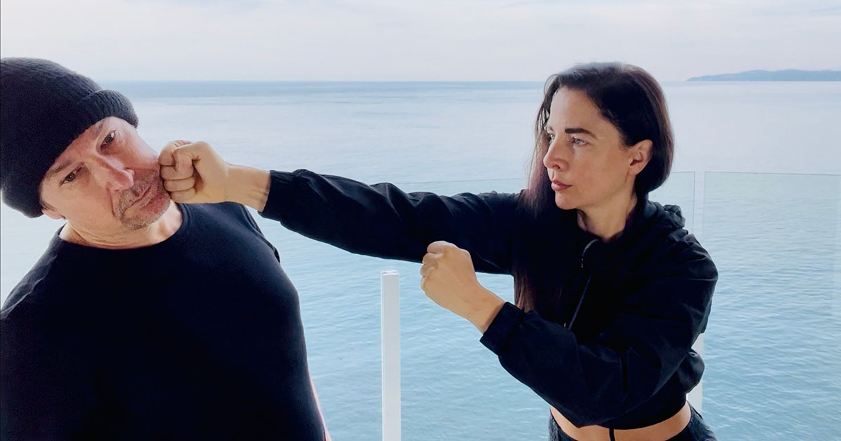 Sifu Kendra Mahon demonstrating Wing Chun guard compared to a boxing guard